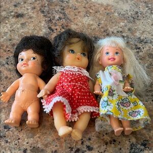 Adorable Doll Trio Set with Red and Floral Dresses